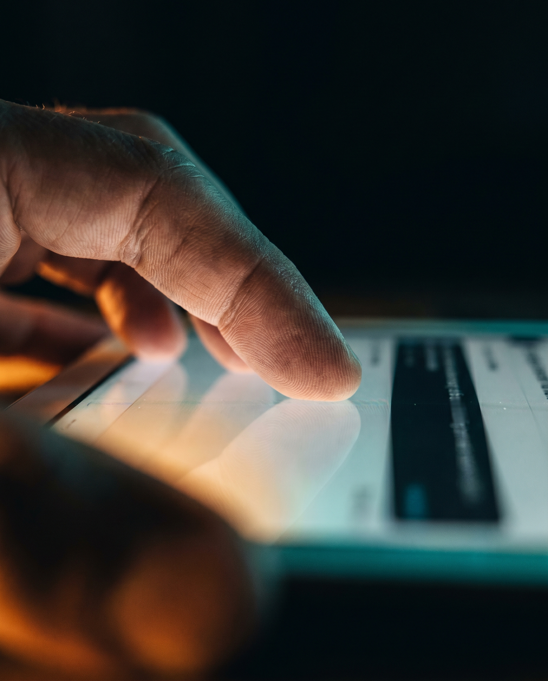 Photorealistic editorial photograph: extreme close-up of a single hand scrolling through an endlessly long document on a tablet, rim lighting from below casting dramatic upward shadows across fingers
